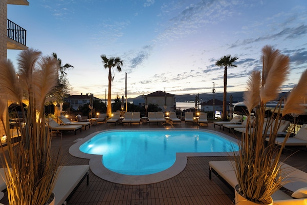Seasonal outdoor pool, open 10:00 AM to 7:30 PM, pool umbrellas