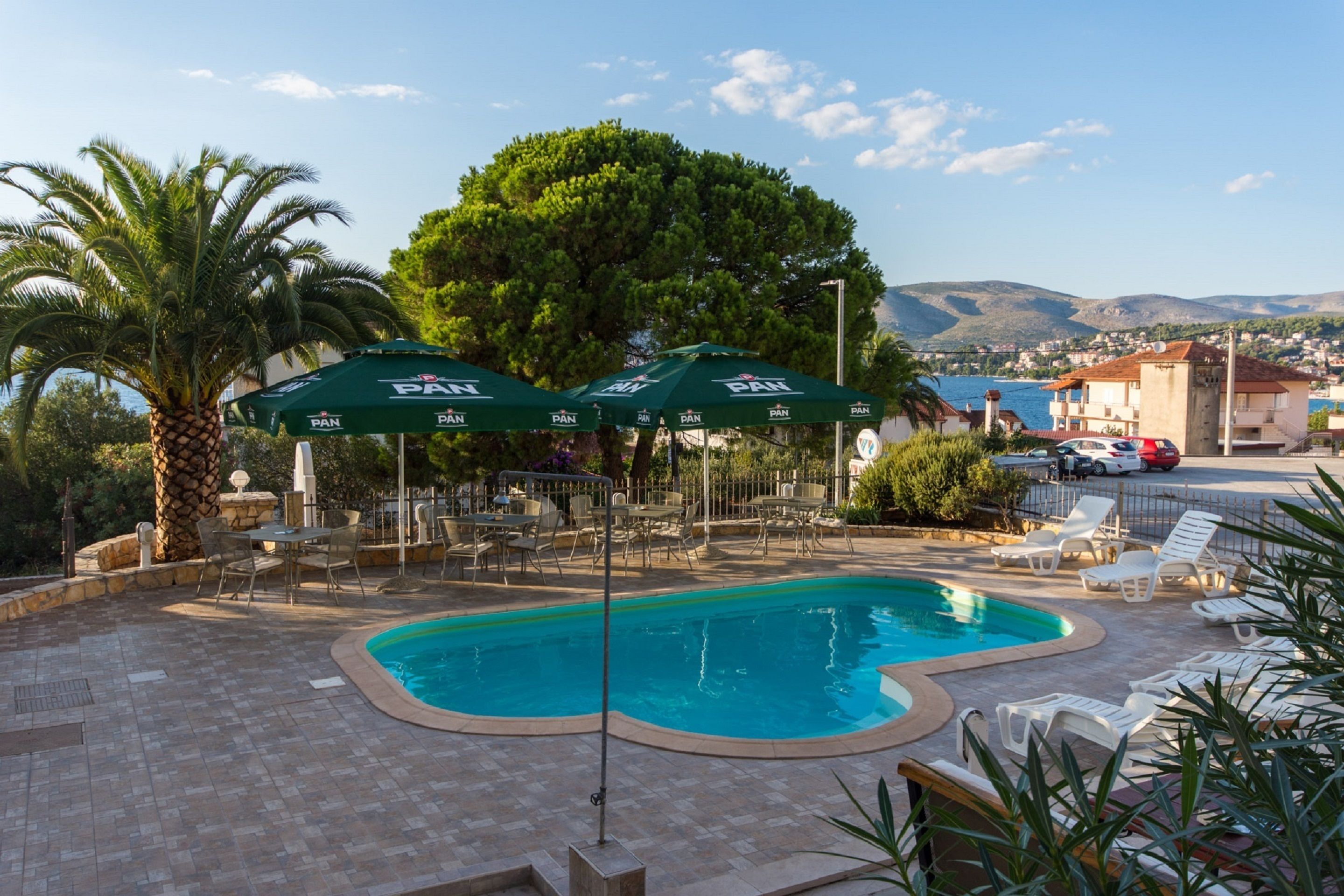 outdoor pool, pool loungers