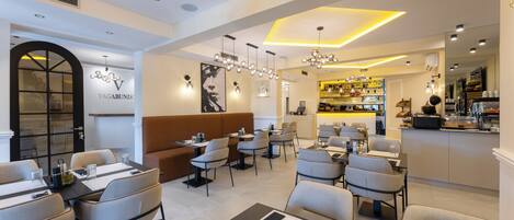 A modern restaurant interior with a bar area, seating arrangements, and a visible menu board.