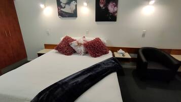 Deluxe Room, 1 King Bed | 1 bedroom, desk, blackout curtains, iron/ironing board