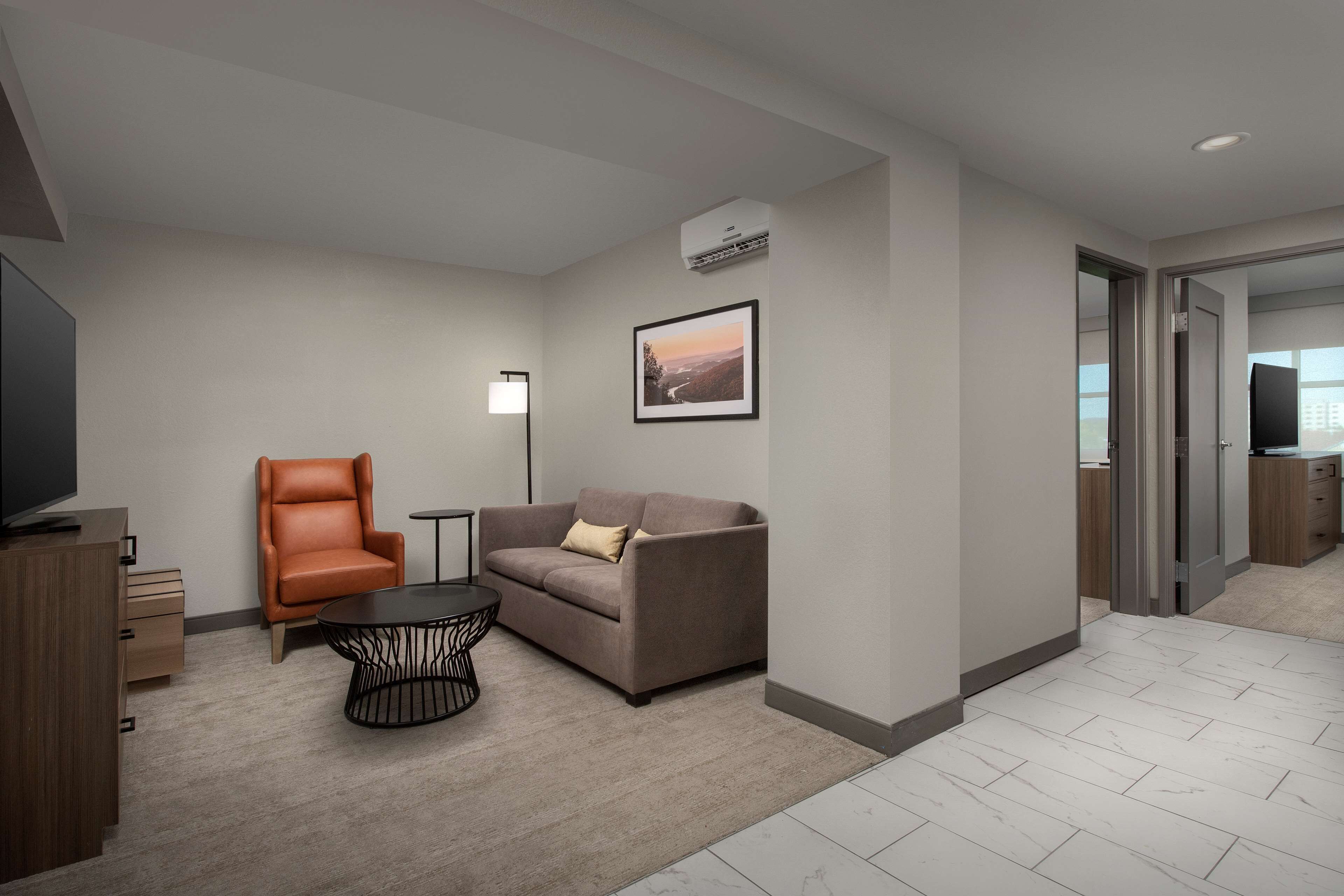 king, suite, 2 bedrooms | living area | tv