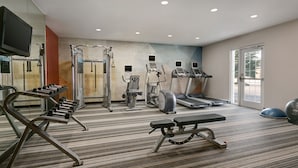 A gym with treadmills, weight machines, and a bench. - Candlewood Suites Murfreesboro by IHG (Murfreesboro)