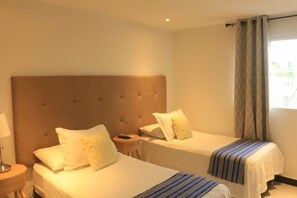 Habitación Deluxe con 1 cama matrimonial o 2 individuales | Minibar, caja de seguridad en la habitación y wifi gratis 