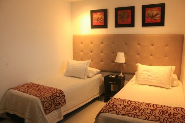 Habitación Deluxe con 1 cama matrimonial o 2 individuales | Minibar, caja de seguridad en la habitación y wifi gratis 