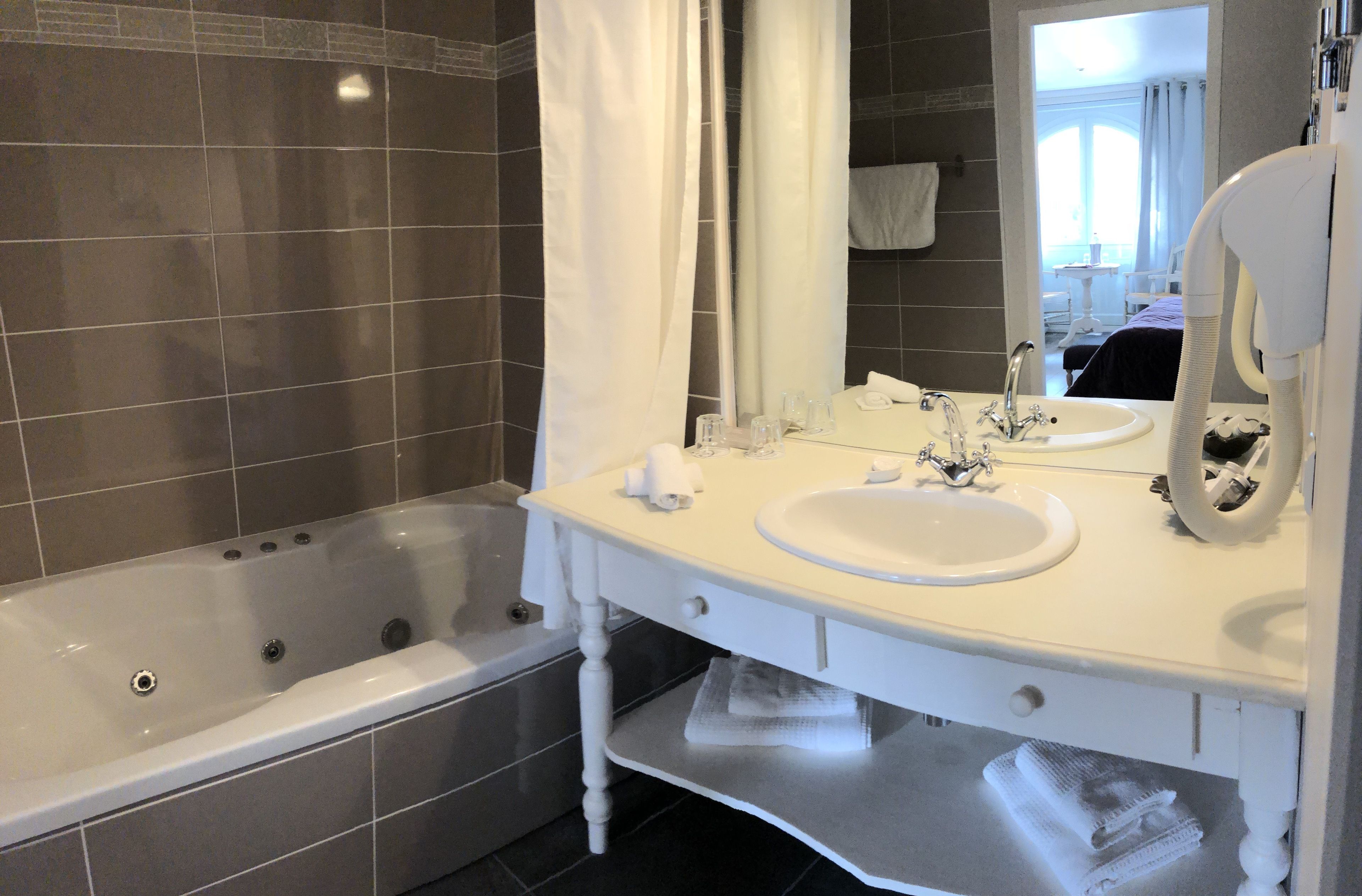 hair dryer, bathrobes, slippers, towels