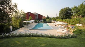 Seasonal outdoor pool, pool umbrellas, pool loungers