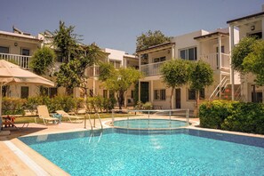 Outdoor pool, open 9:00 AM to 8:30 PM, pool umbrellas, pool loungers