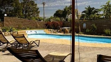 2 outdoor pools, open 6:00 AM to 10:00 PM, pool umbrellas, pool loungers