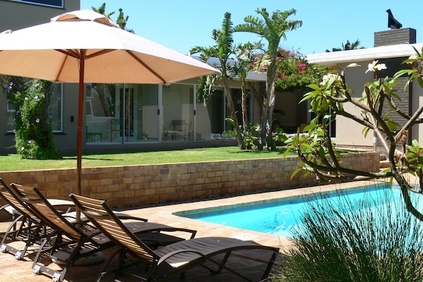 2 outdoor pools, open 6:00 AM to 10:00 PM, pool umbrellas, sun loungers