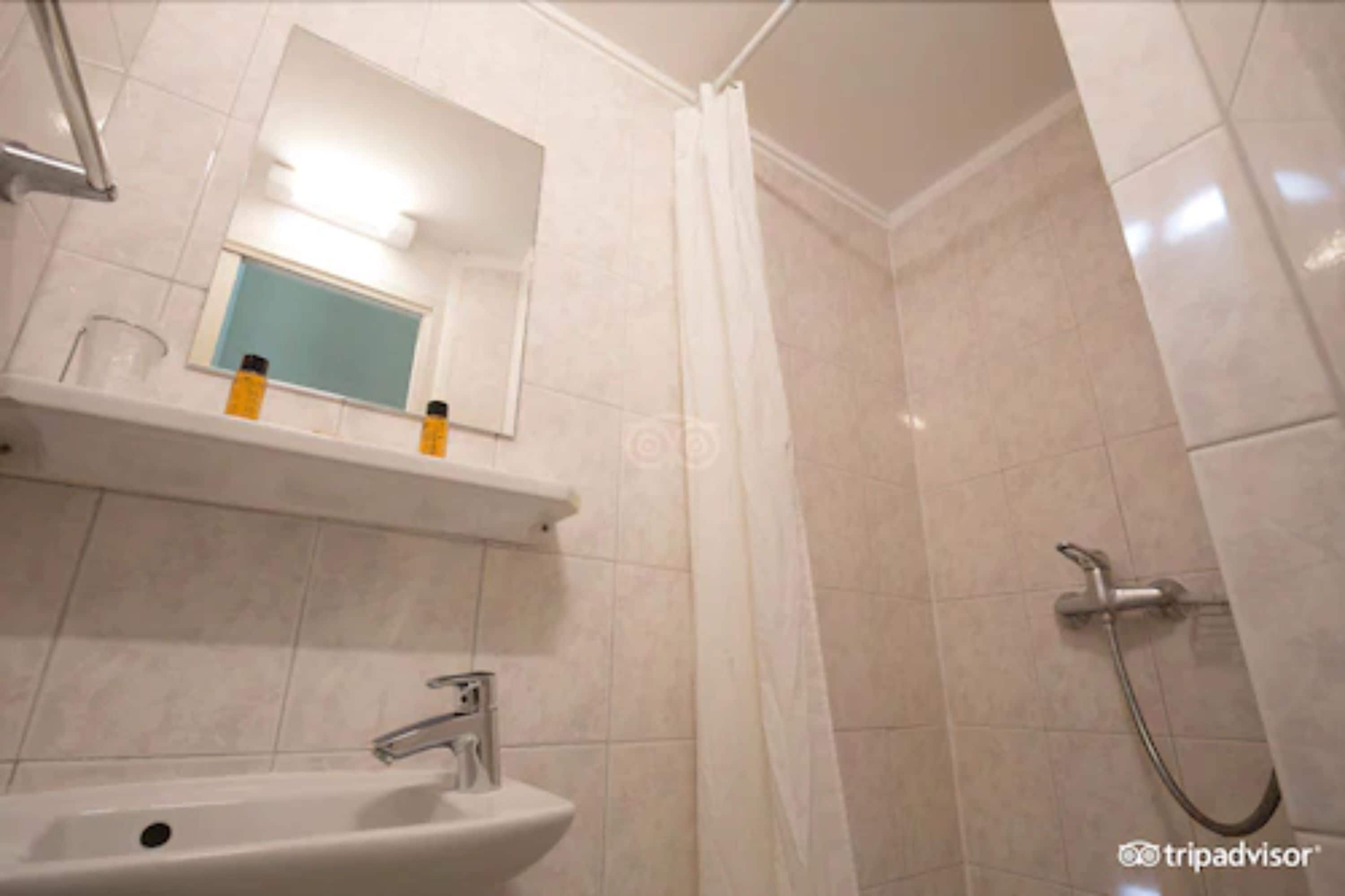 single room | bathroom | shower, hair dryer, towels