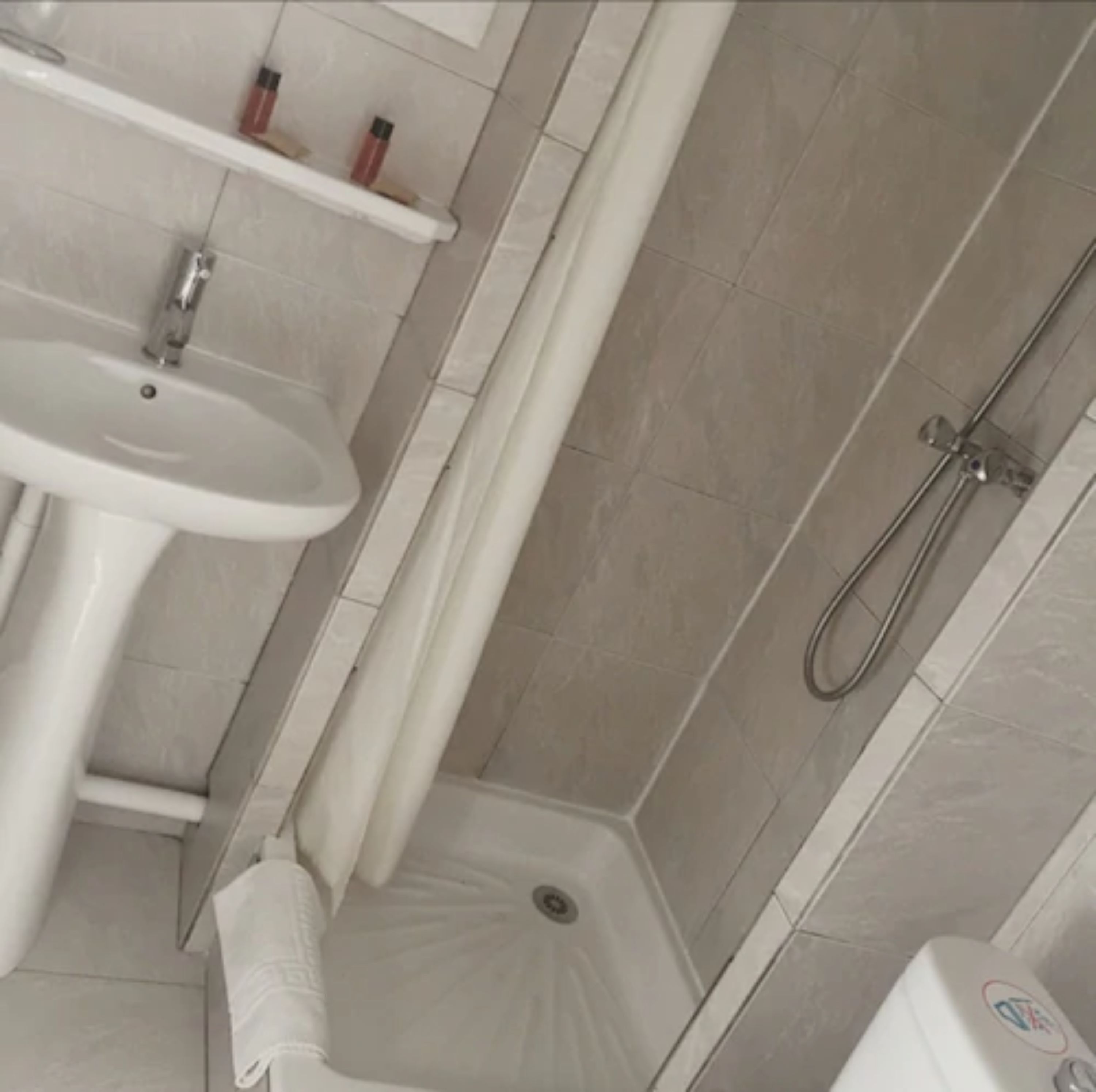 standard double room | bathroom | shower, hair dryer, towels