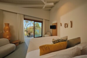 Junior Suite, Balcony, Sea View | Minibar, in-room safe, individually decorated, desk