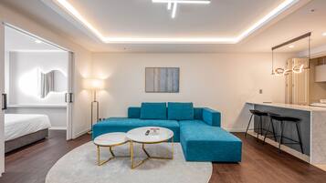 Premier Suite | Living area | 32-inch flat-screen TV with cable channels