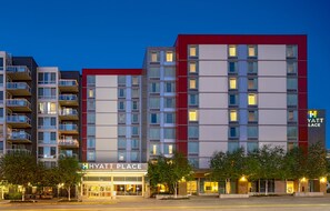 A multi-story hotel with a modern design, featuring a prominent sign for 'HYATT PLACE' and a 'YATT LACE' logo. - Hyatt Place Seattle Downtown (Seattle)
