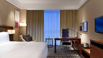 Premium bedding, down comforters, minibar, in-room safe