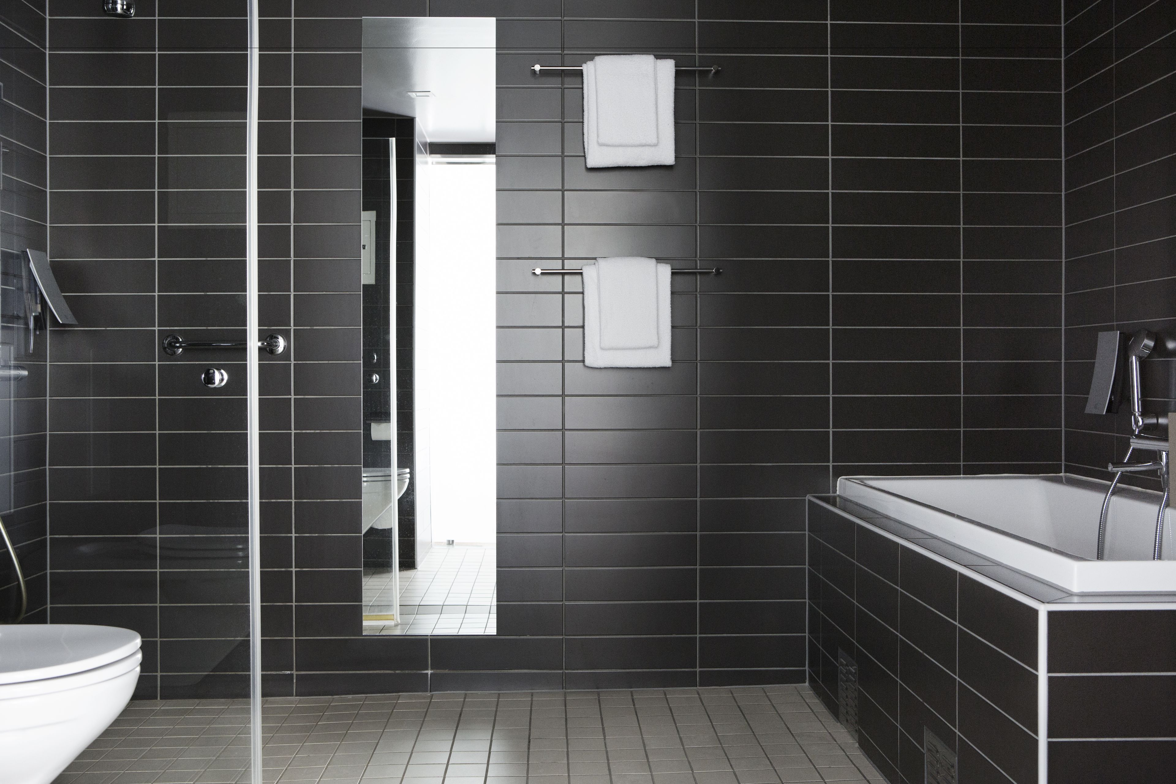 shower, rainfall showerhead, hair dryer, towels