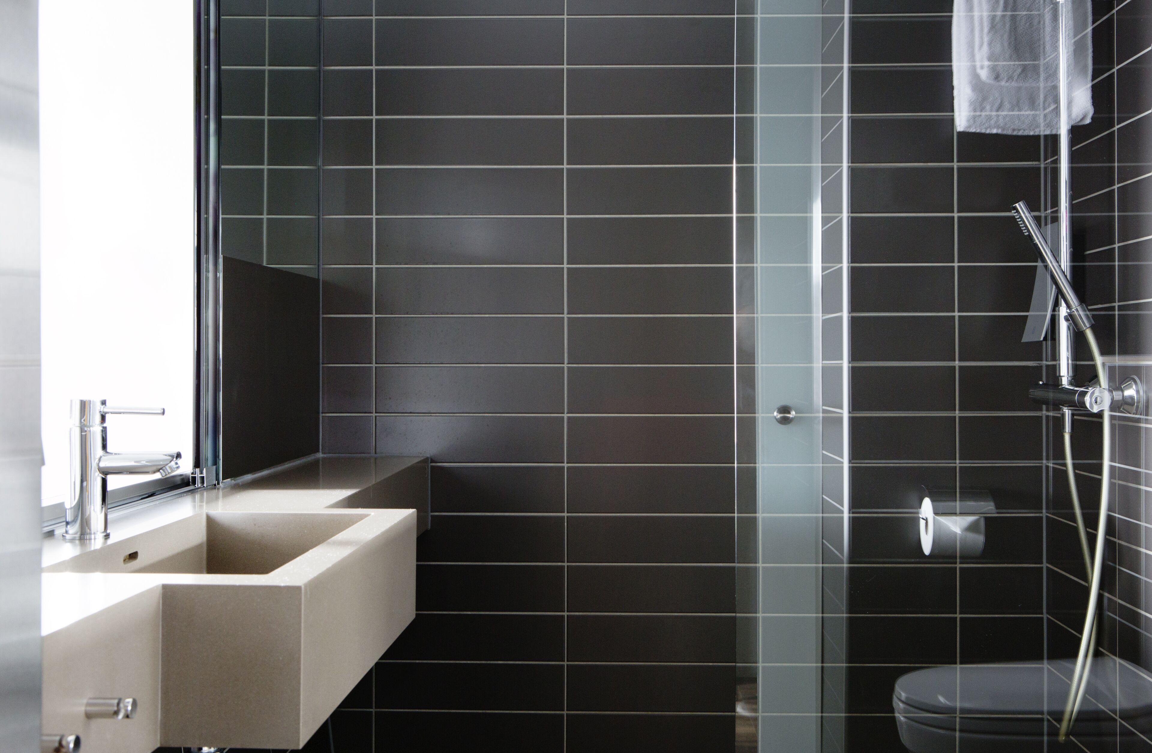 shower, rainfall showerhead, hair dryer, towels