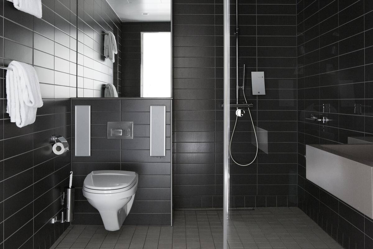 shower, rainfall showerhead, hair dryer, towels