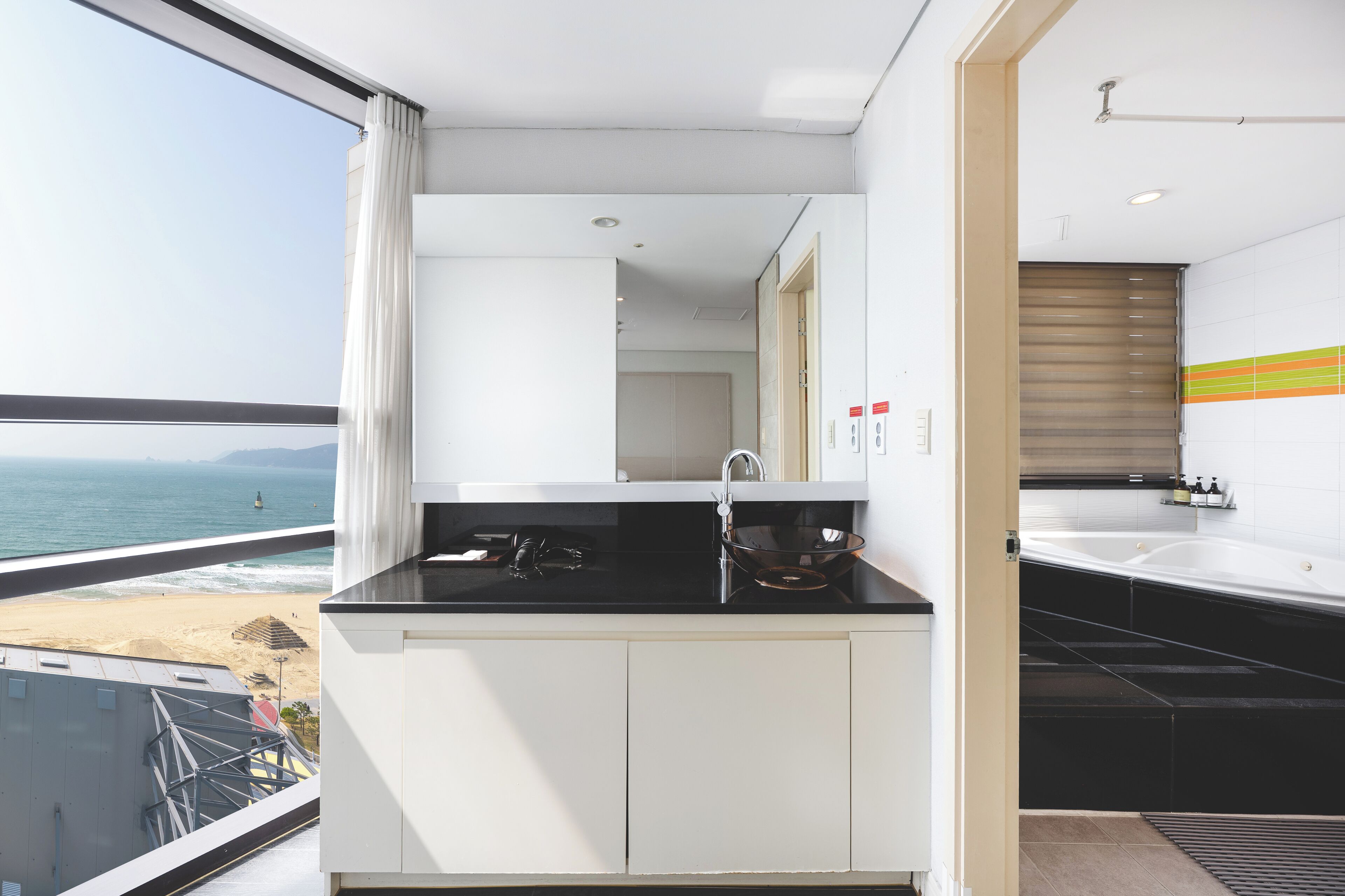 family queen twin ocean view | bathroom | hair dryer, bathrobes, slippers, bidet