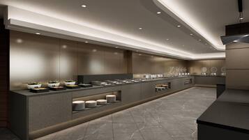 A modern kitchen with a long counter, built-in appliances, and a clean, minimalist design.