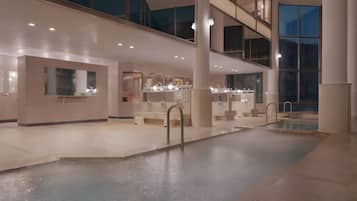 Clean and well-lit public restroom with multiple sinks and mirrors.
