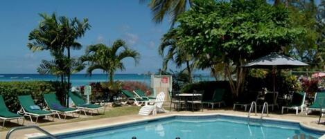 Outdoor pool, pool umbrellas, sun loungers