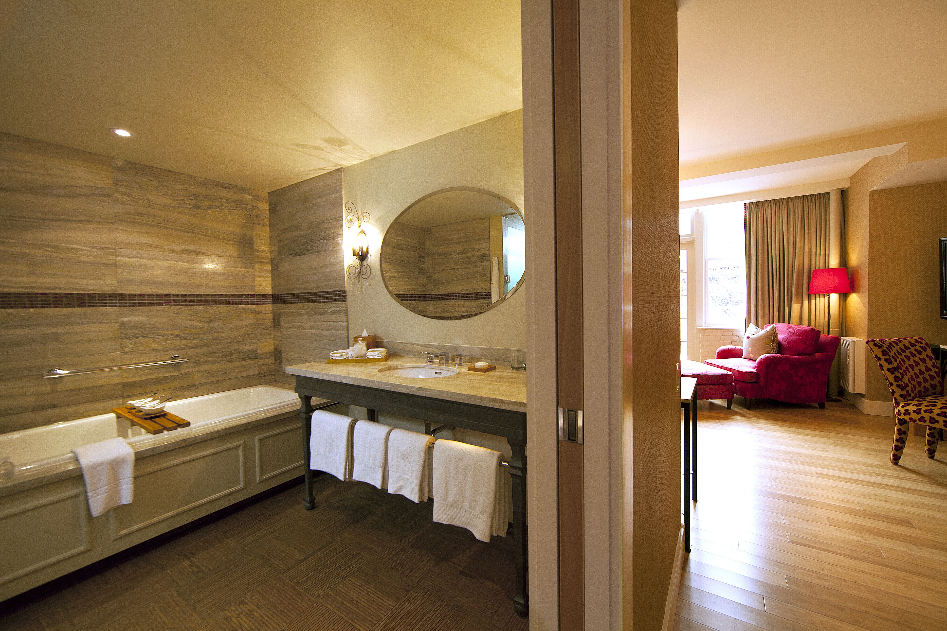 deluxe room, 1 king bed | bathroom | separate bathtub and shower, designer toiletries, hair dryer, bathrobes