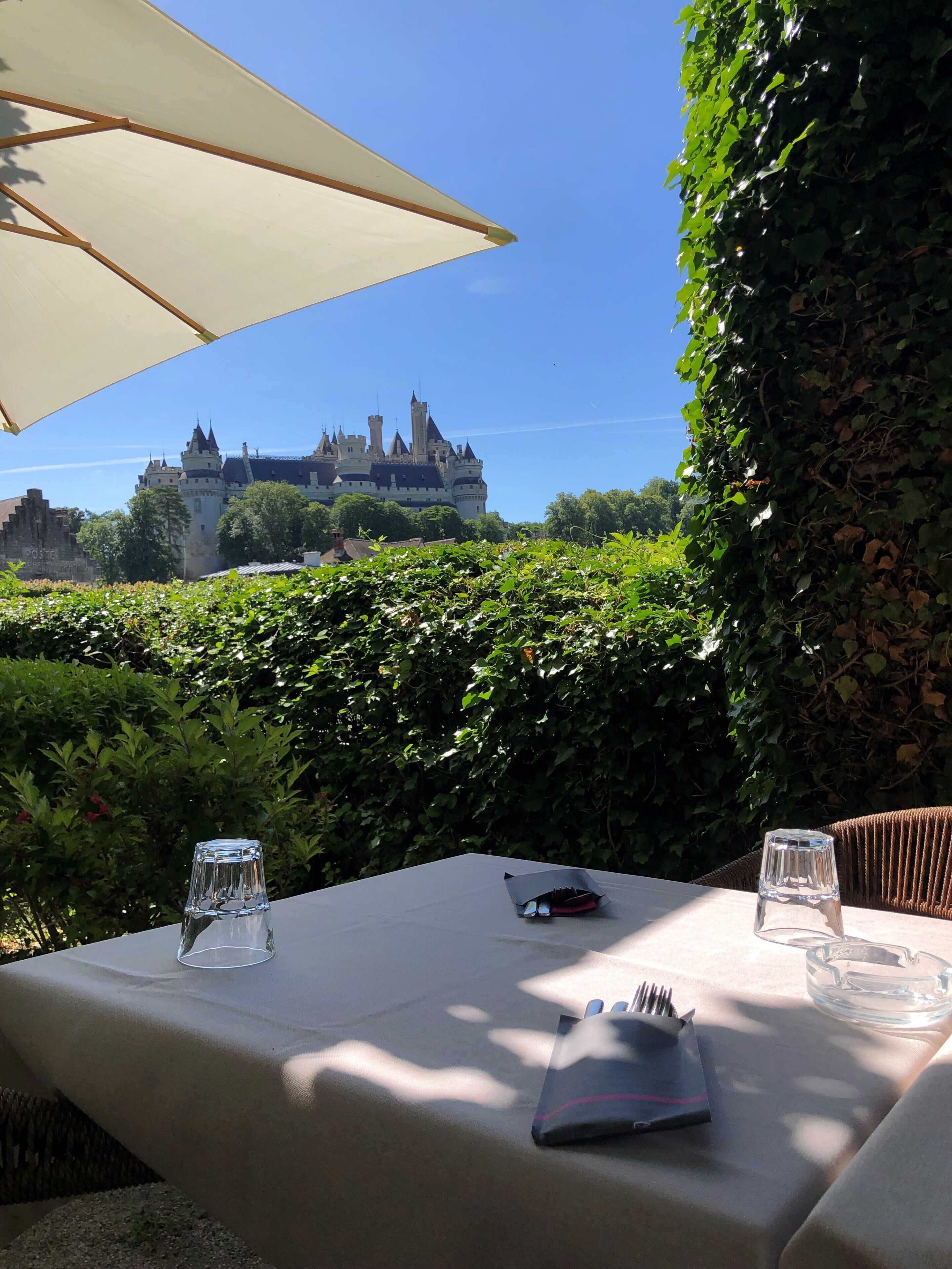 A table with a clear view of a castle in the background.