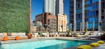 Outdoor pool, sun loungers, lifeguards on site at Royalton Park Avenue