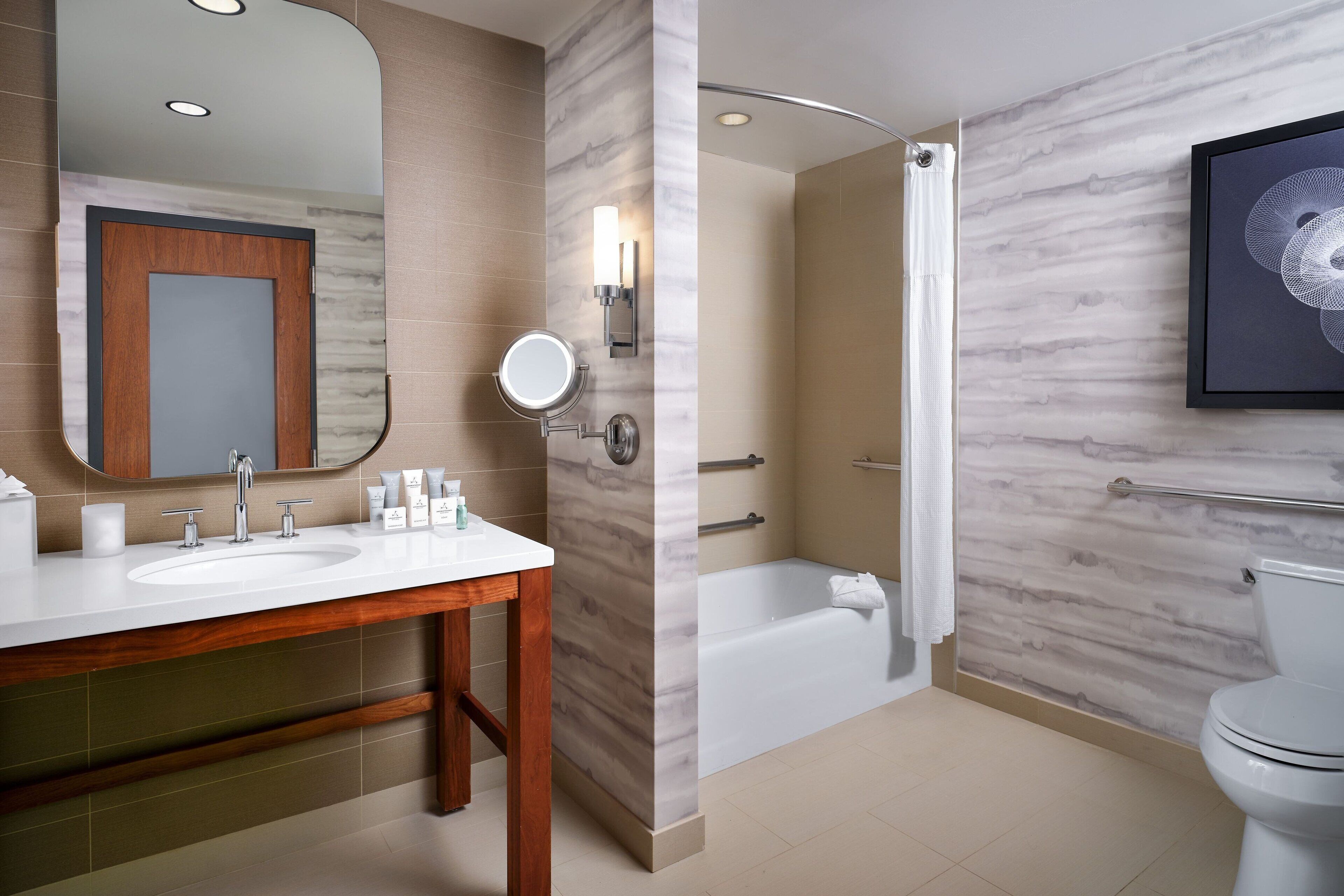 combined shower/bathtub, designer toiletries, hair dryer, bathrobes