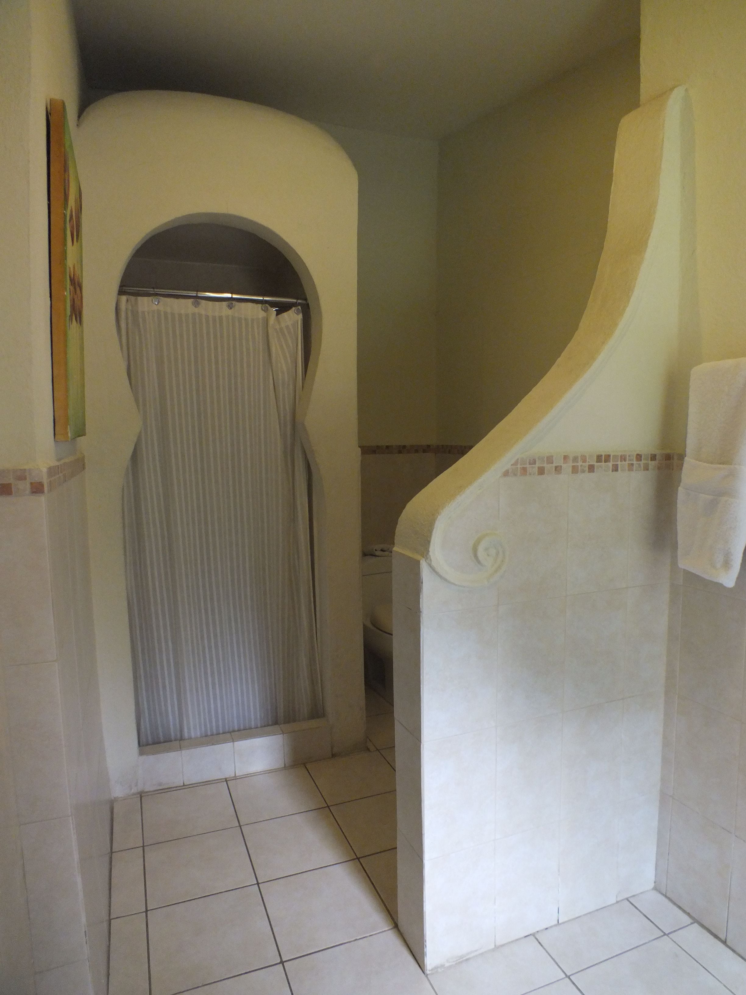 junior room, garden view | bathroom | shower, free toiletries, hair dryer, towels
