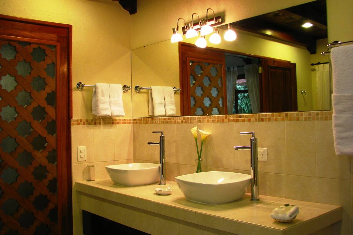 junior room, garden view | bathroom | shower, free toiletries, hair dryer, towels