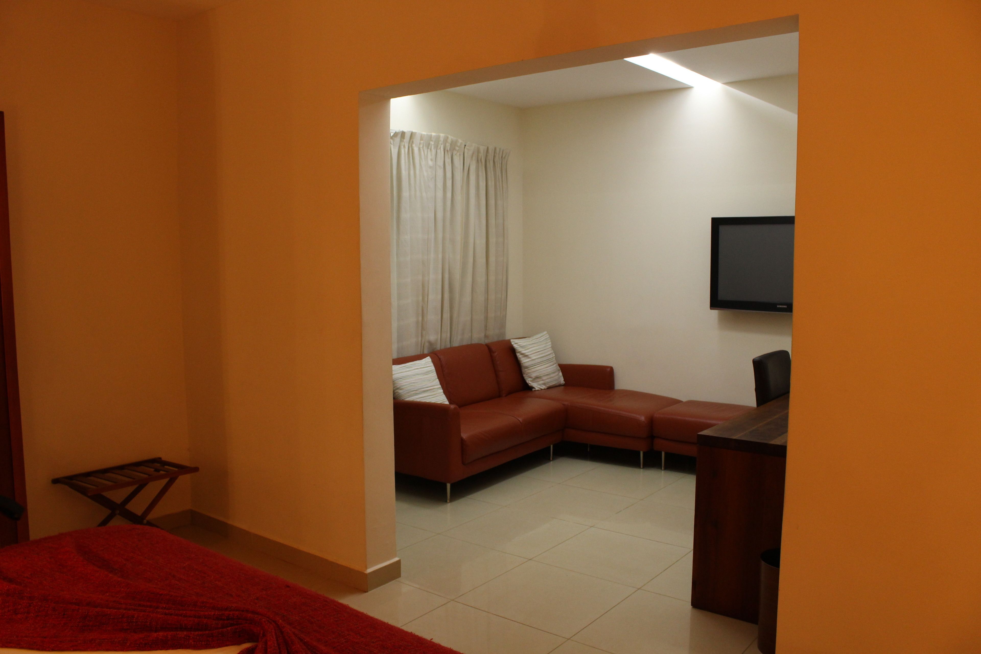 Habitación Deluxe | Ropa de cama de alta calidad y edredones de plumas