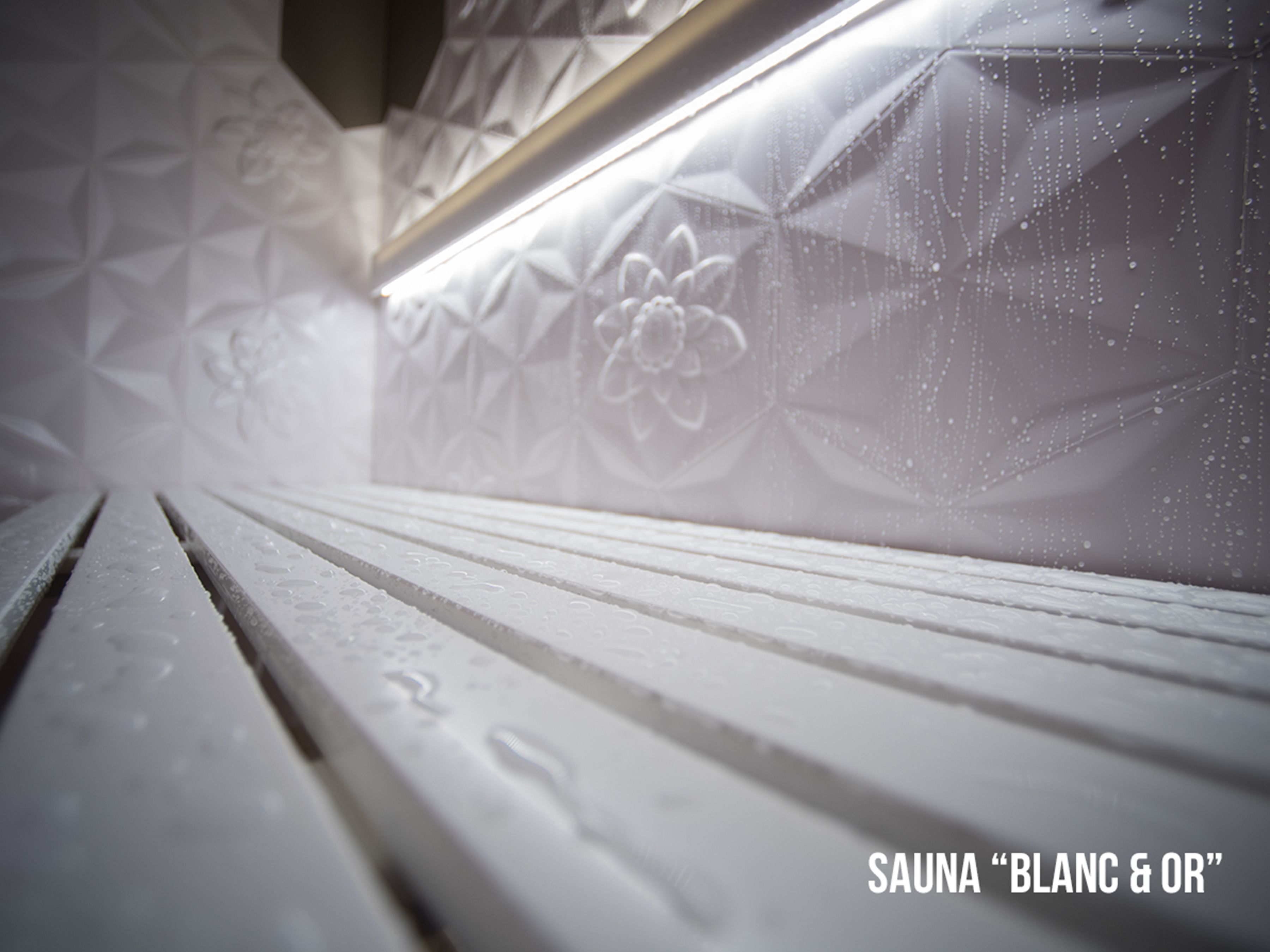 A close-up of a sauna with geometric patterns and a wooden bench.