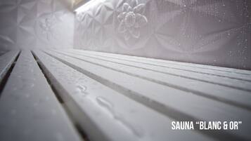 A close-up of a sauna with geometric patterns and a wooden bench.