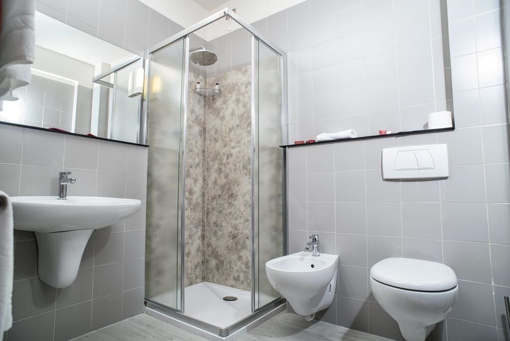 single room | bathroom | rainfall showerhead, free toiletries, hair dryer, slippers