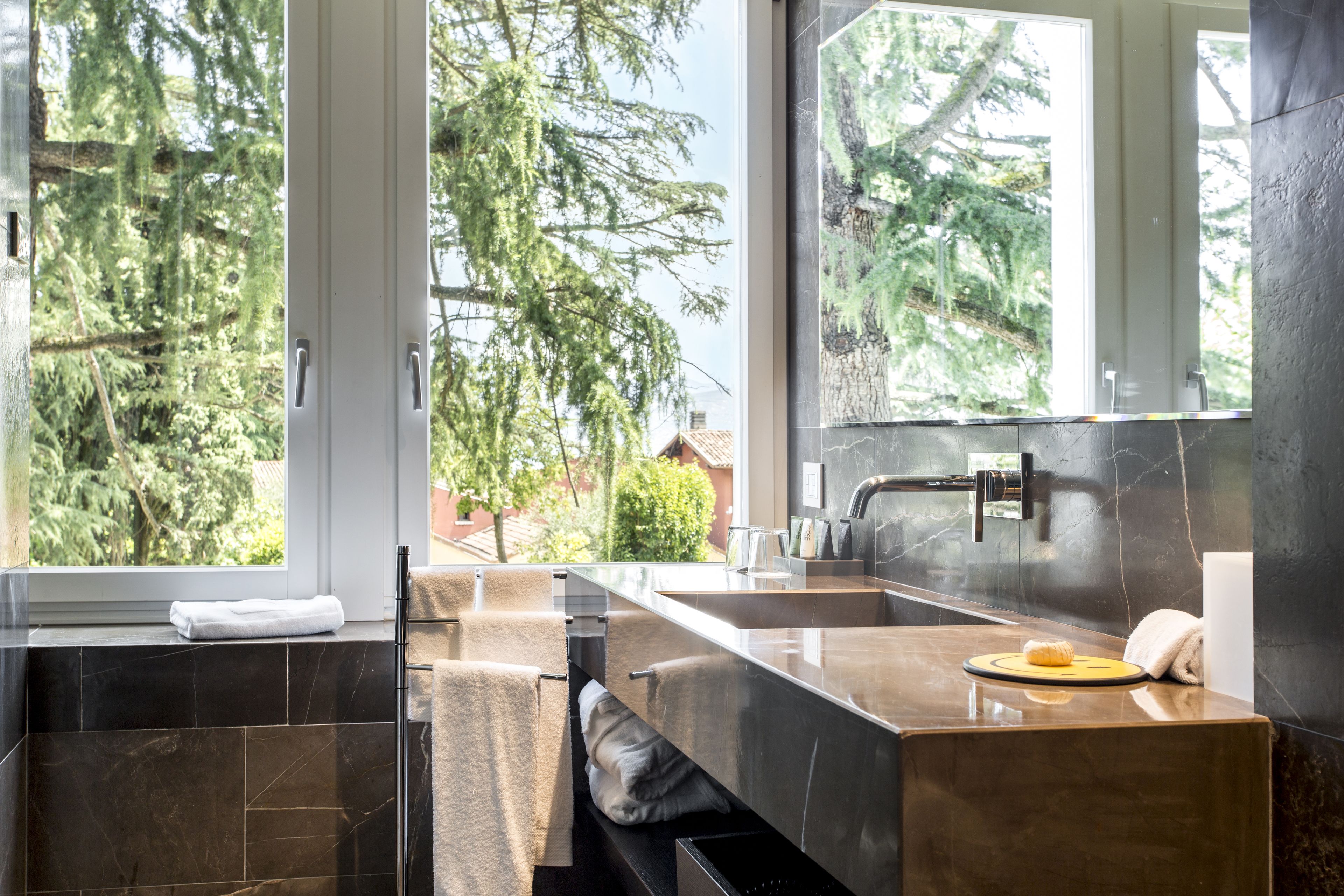 rainfall showerhead, designer toiletries, hair dryer, slippers