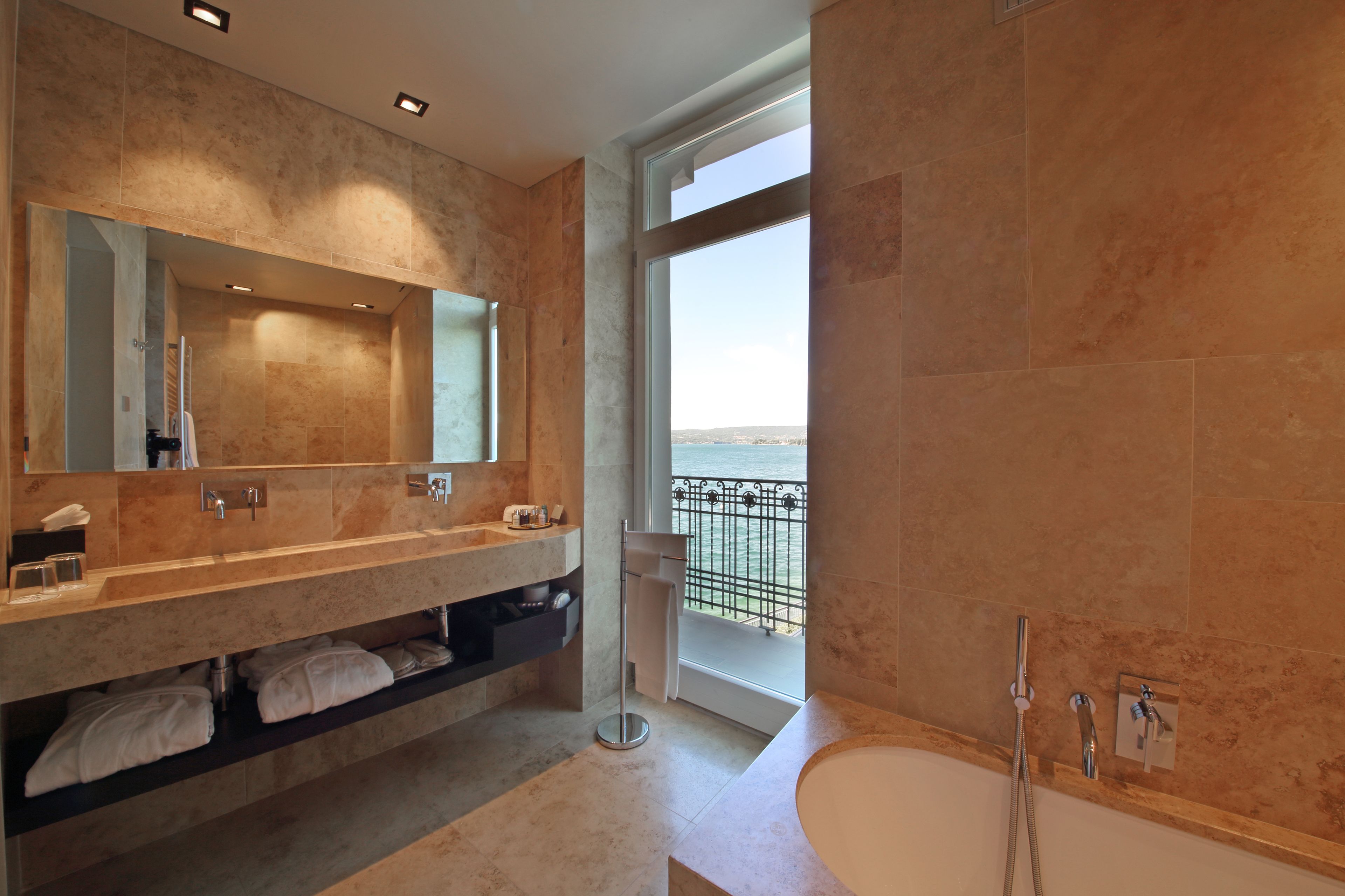 rainfall showerhead, designer toiletries, hair dryer, slippers