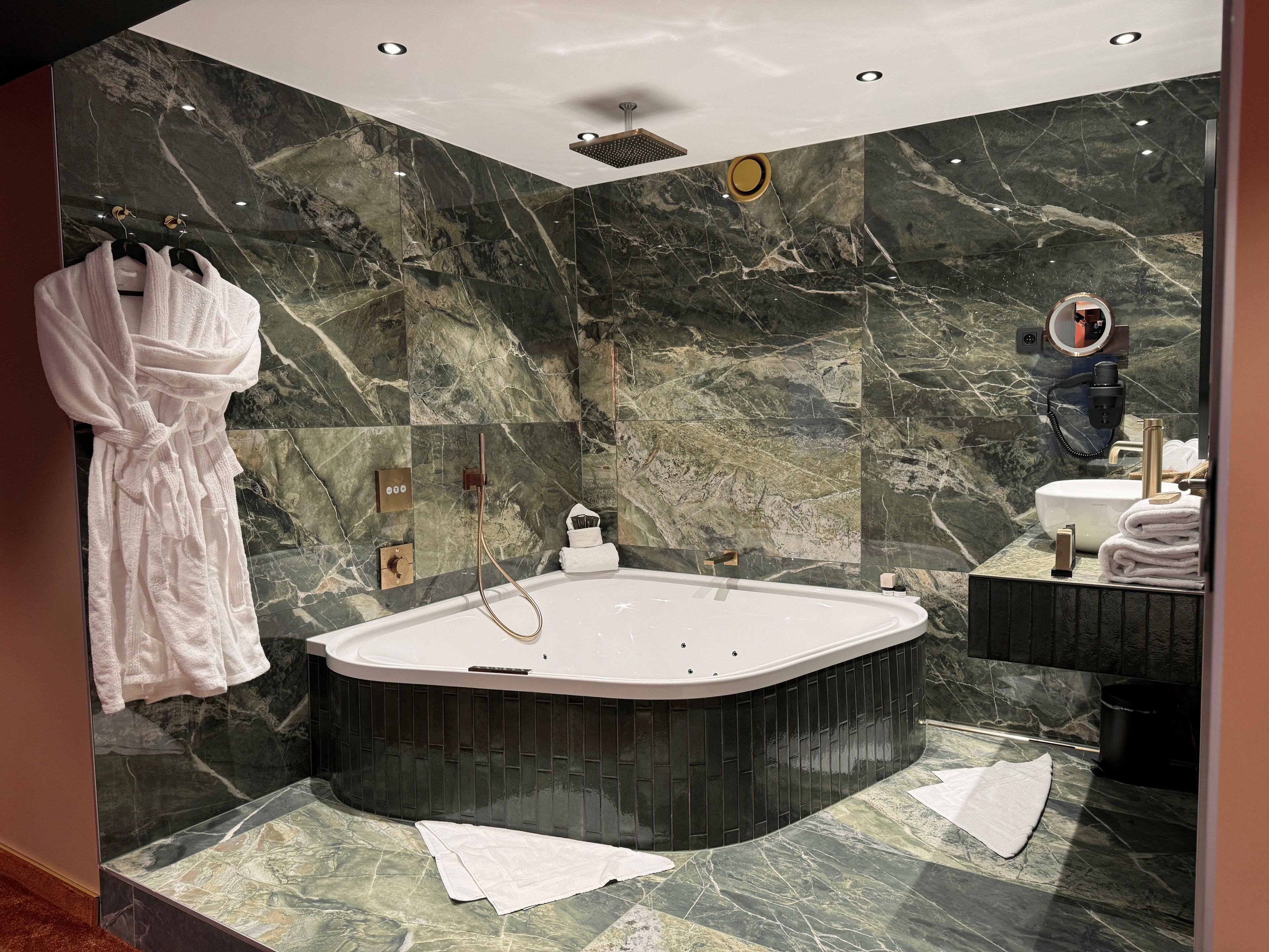 romantic suite | bathroom | hair dryer, slippers, towels