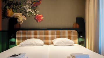 Signature kamer, 1 twee- of 2 eenpersoonsbedden | Individueel gedecoreerd, individueel gemeubileerd