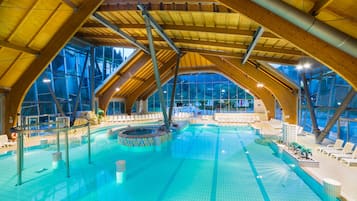 Indoor pool, pool umbrellas, pool loungers