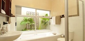 Separate bathtub and shower, hair dryer, towels
