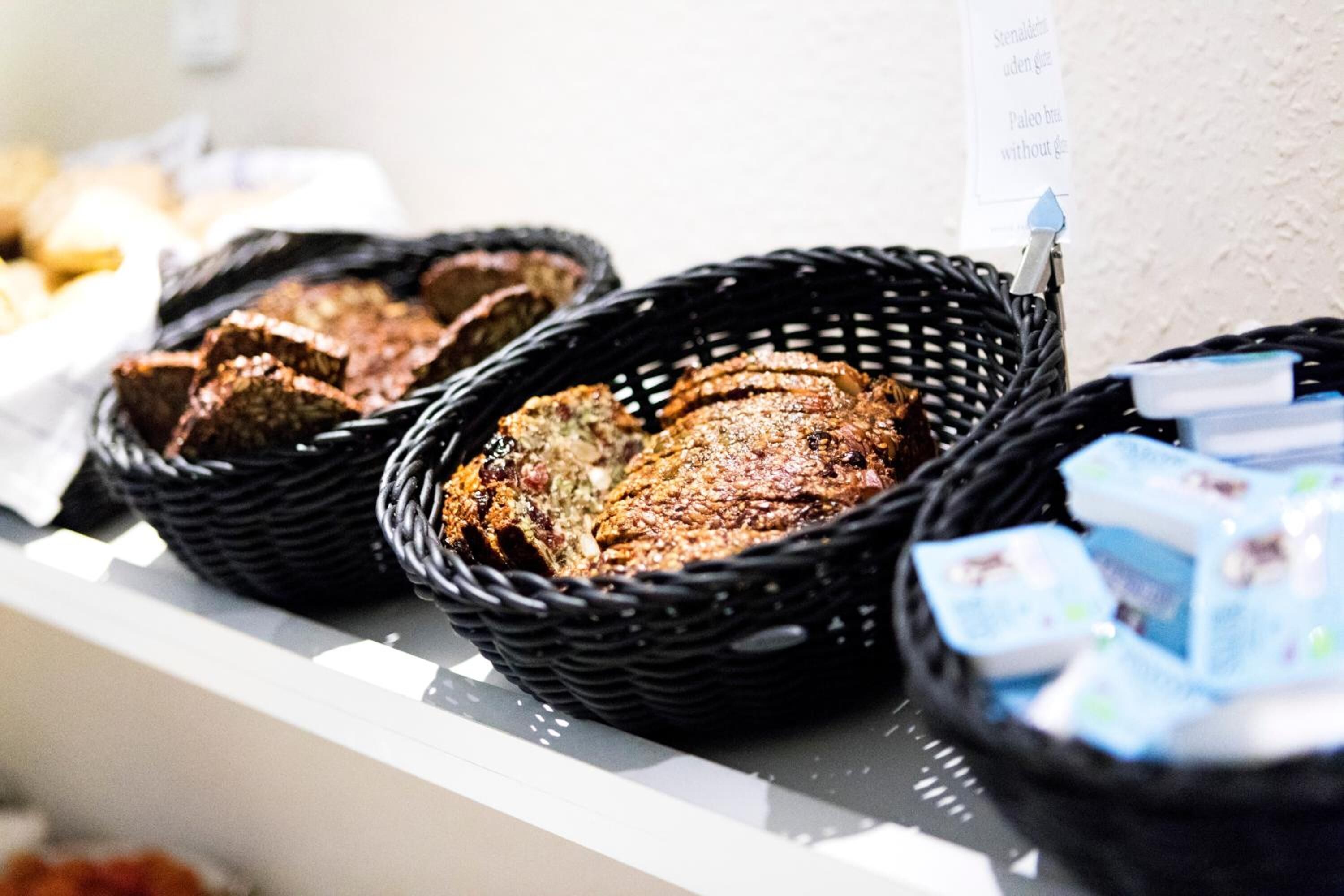 A buffet with various food items, including bread and packaged goods.