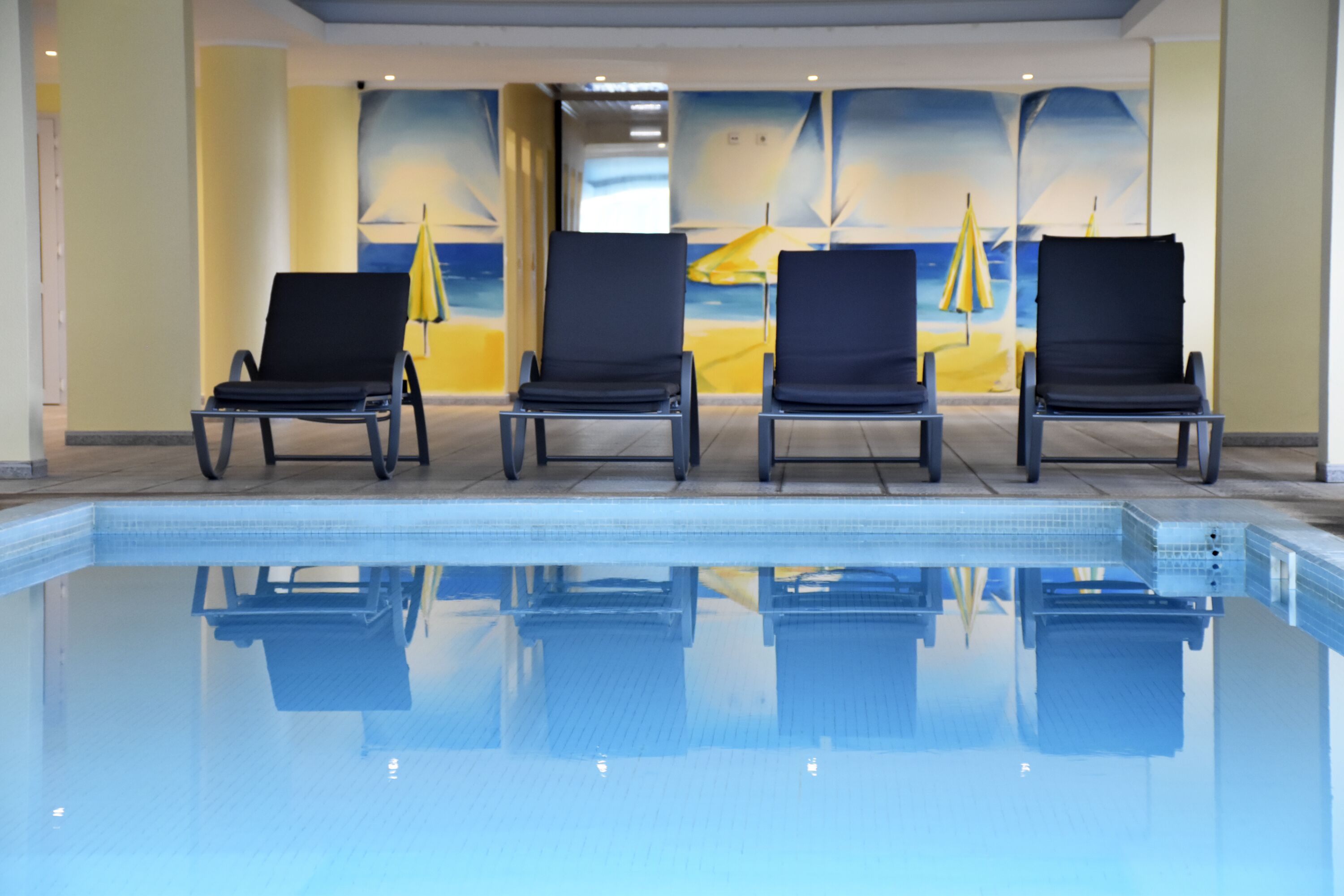 indoor pool, open 10:00 am to 6:00 pm, pool loungers