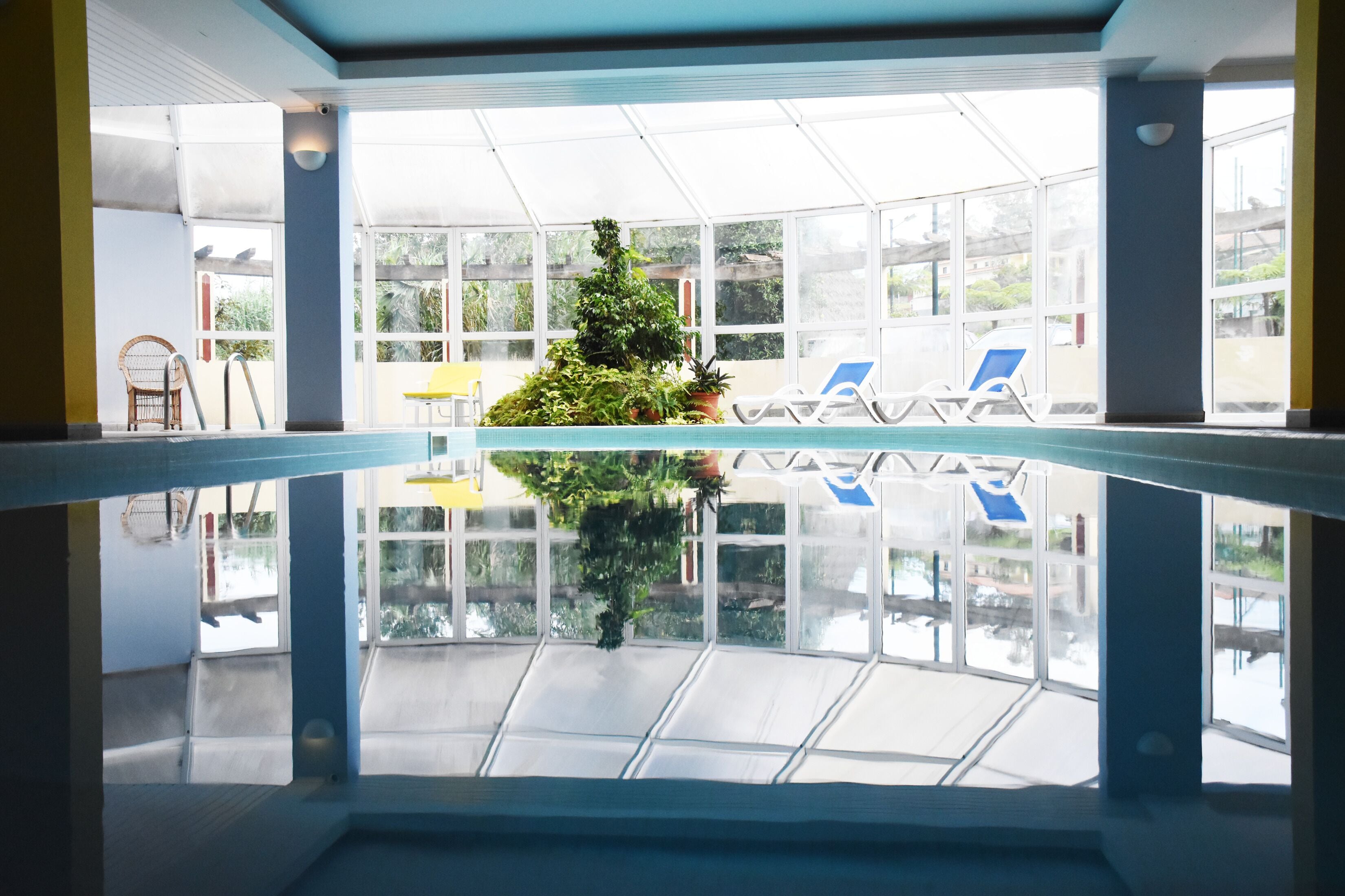 Indoor pool, open 10:00 AM to 6:00 PM, pool loungers