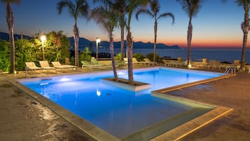 Seasonal outdoor pool, pool umbrellas, pool loungers