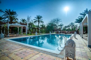 Outdoor pool, free pool cabanas, pool umbrellas