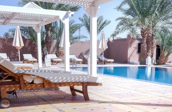 Outdoor pool, free pool cabanas, pool umbrellas