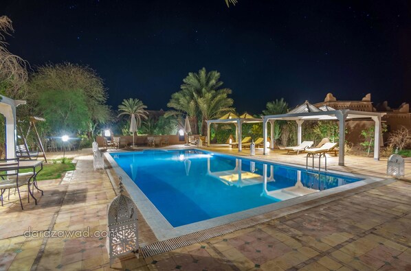 Outdoor pool, free cabanas, pool umbrellas