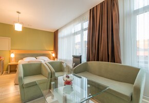 Deluxe Suite | Living area | 32-inch Smart TV with satellite channels